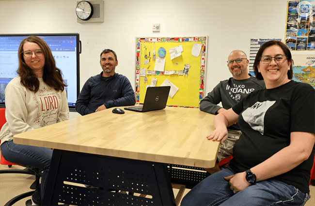 Students at table in a Star Academy classroom